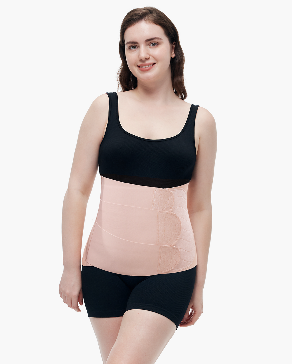 Momcozy Ergowrap Postpartum Belly Band in oyster pink color, worn by a woman, adjustable straps, postpartum support.