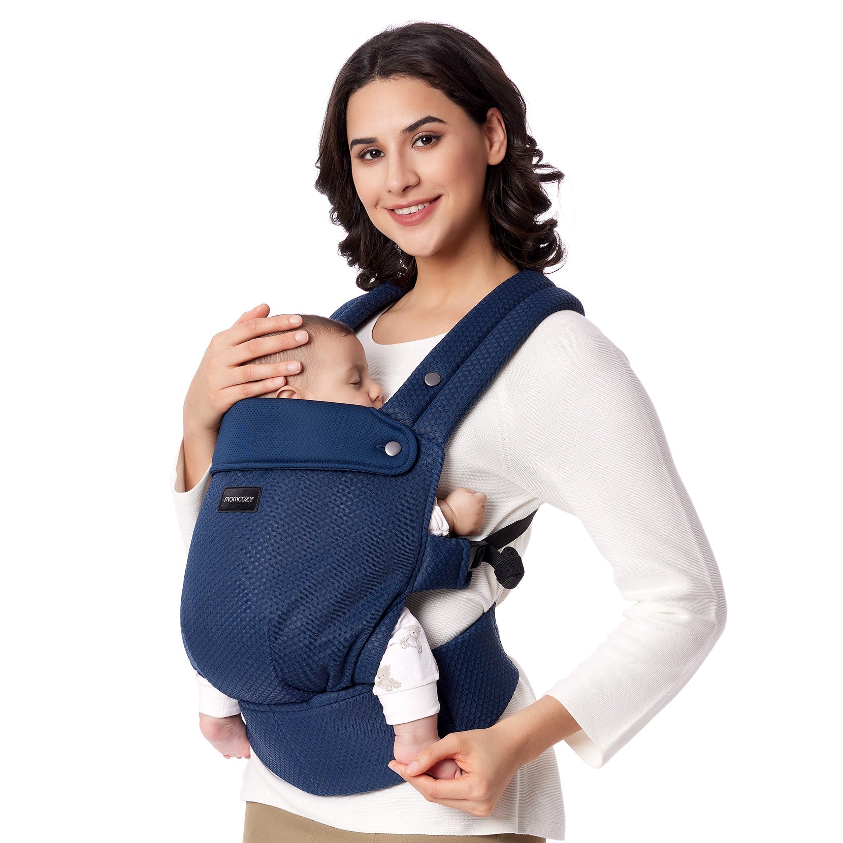 Momcozy PureHug baby carrier in navy blue. Mother comfortably babywearing, ergonomic design for newborns.