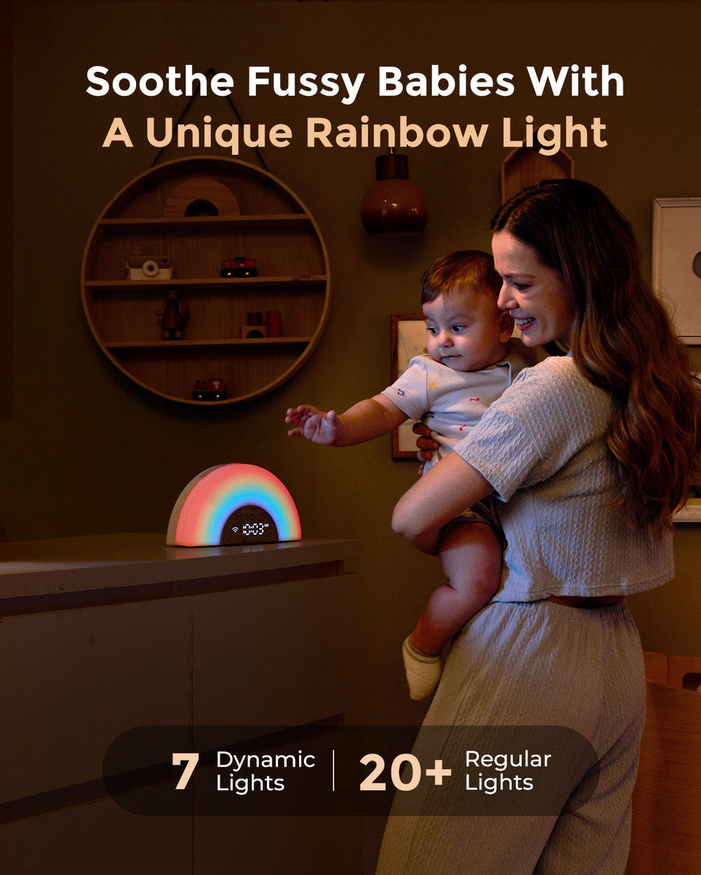 DreamSync Smart Baby Sound Machine with rainbow light, displaying 10:09 AM. Mother holds baby.