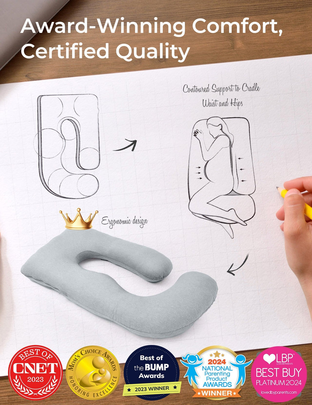 Light grey U-shaped maternity pillow, ergonomic design, supports pregnant women. Award-winning comfort.