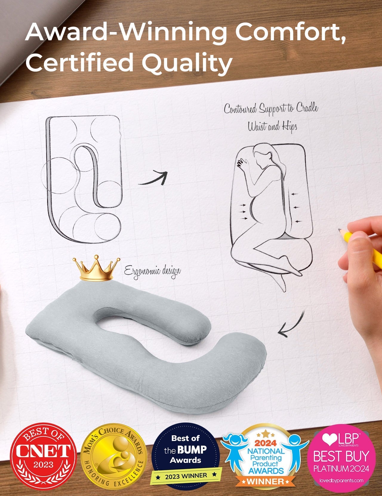 Light grey U-shaped maternity pillow, ergonomic design, supports pregnant women. Award-winning comfort.