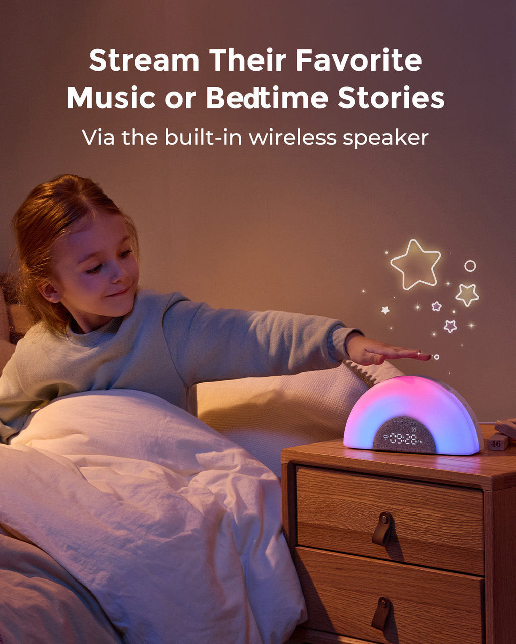 DreamSync Tech smart baby sound machine with rainbow light, on nightstand, with child reaching for it.