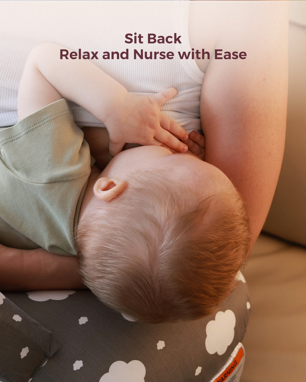 Multifunctional adjustable nursing pillow supporting baby, cloud pattern.